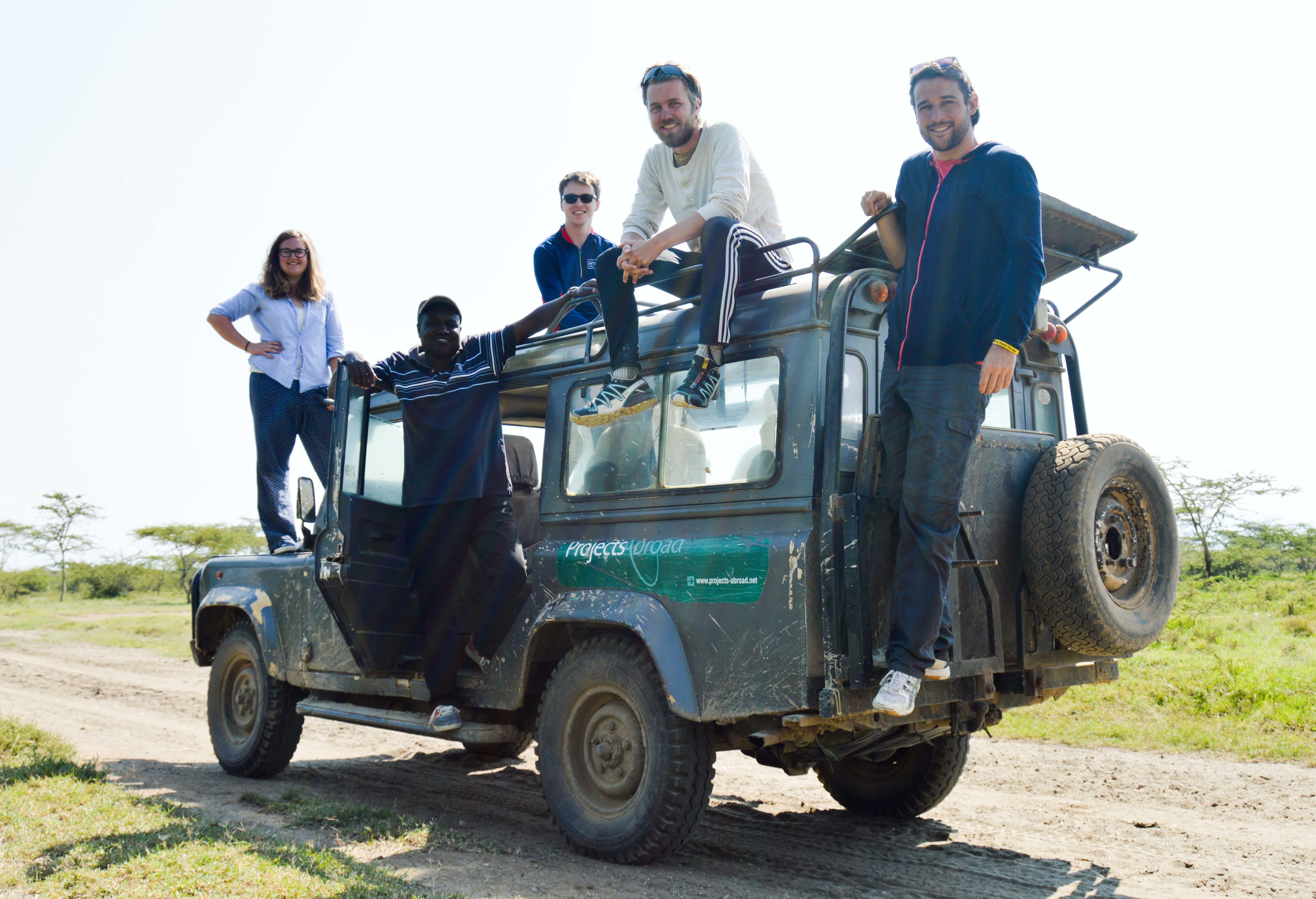 A group of volunteers take a break during their wildlife conservation volunteering project in Kenya with Projects Abroad. A group of volunteers are pictured on a Jeep truck whilst taking a break from their wildlife conservation volunteering in Kenya with Projects Abroad.